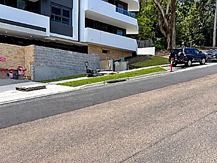 Completed road frontage beside new residential building