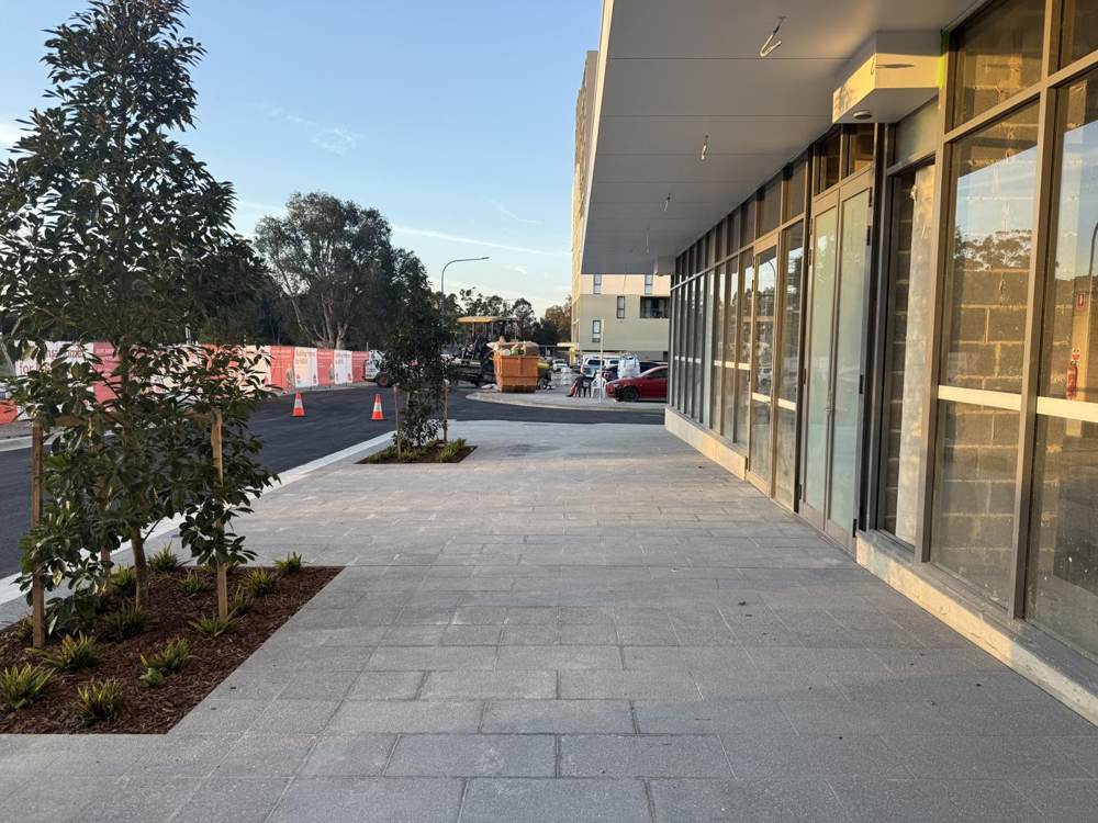 Paved footpath with grated drainage