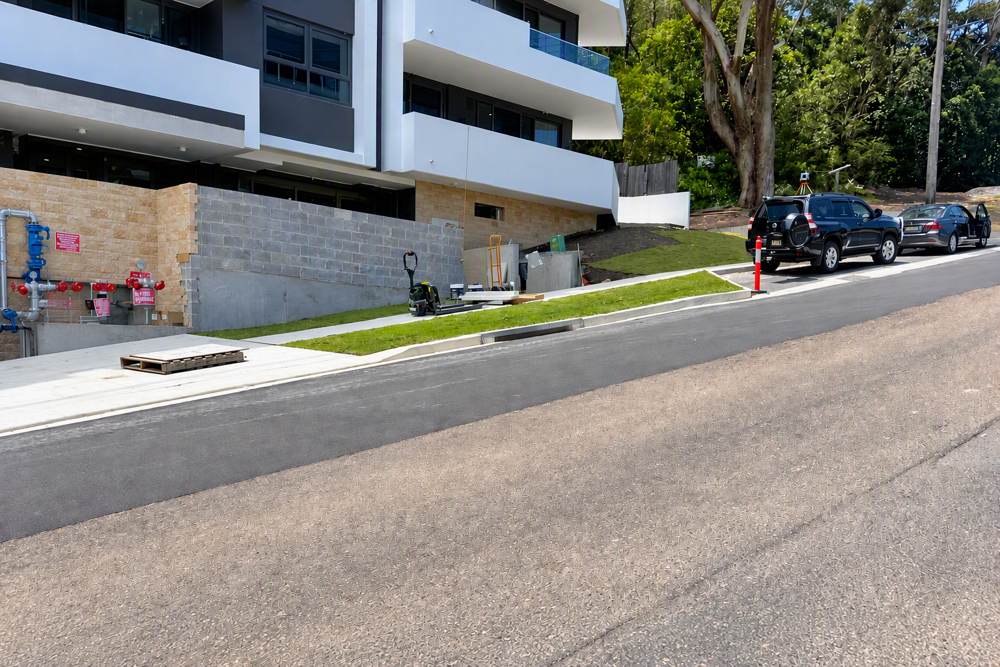 Turfed verge, new footpath and kerb